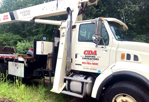 CDA Roofing crew working on a residential roof in Western Massachusetts